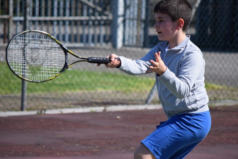 a child playing tennis after a pre-match ritual